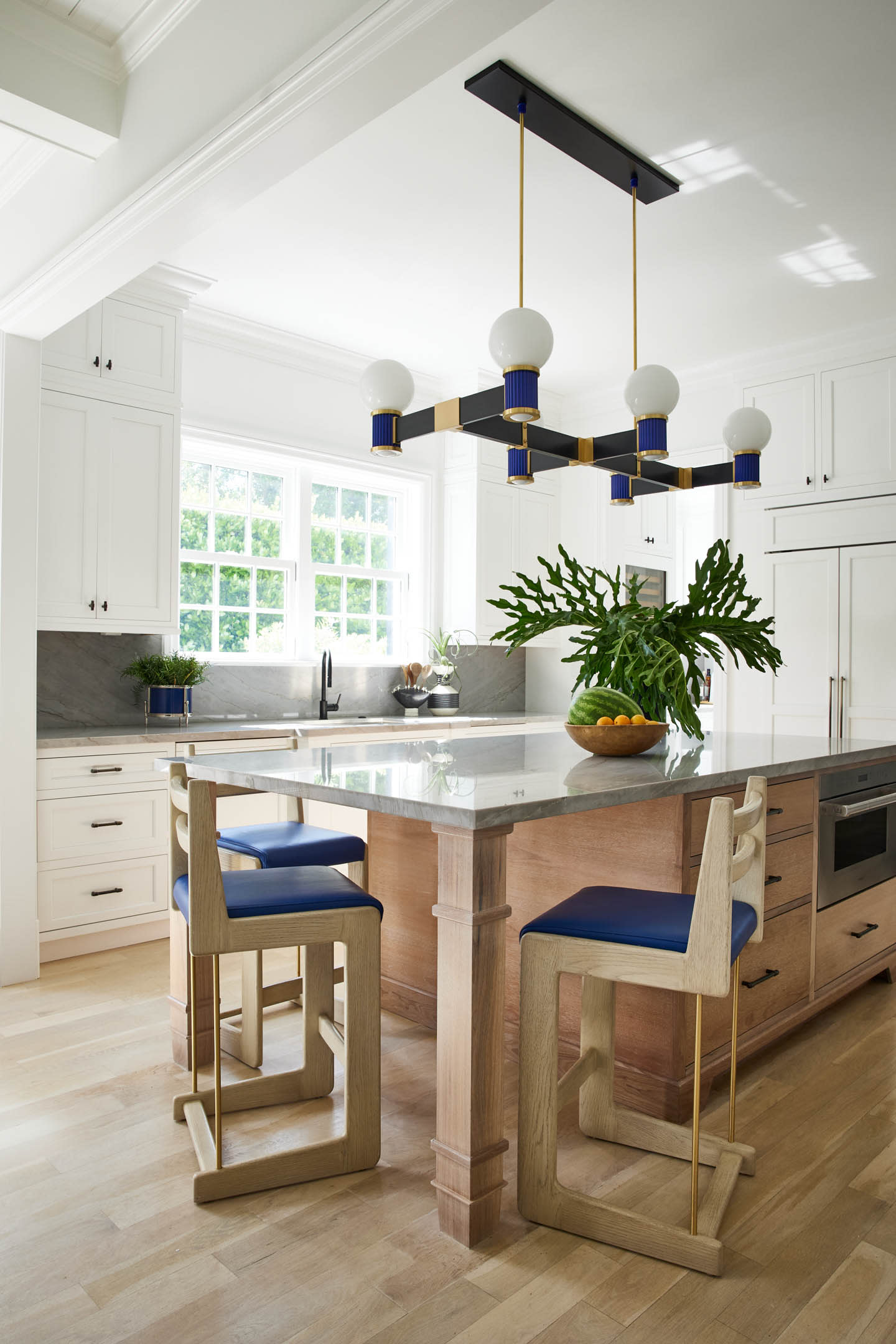 white kitchen with blue furnishings
