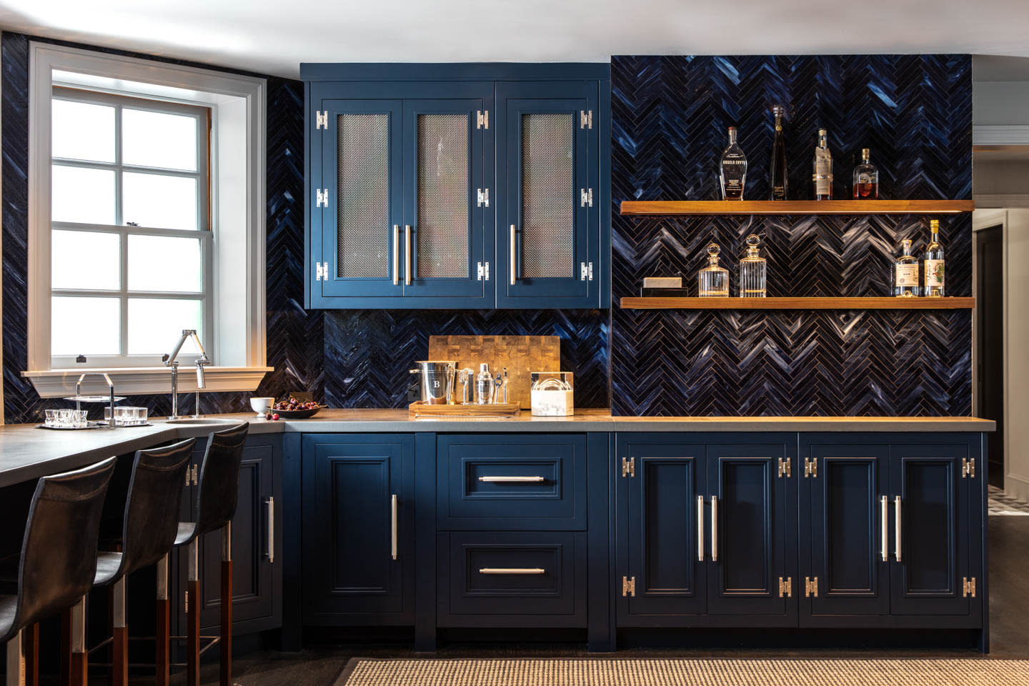 kitchen with dark blue moody cabinetry