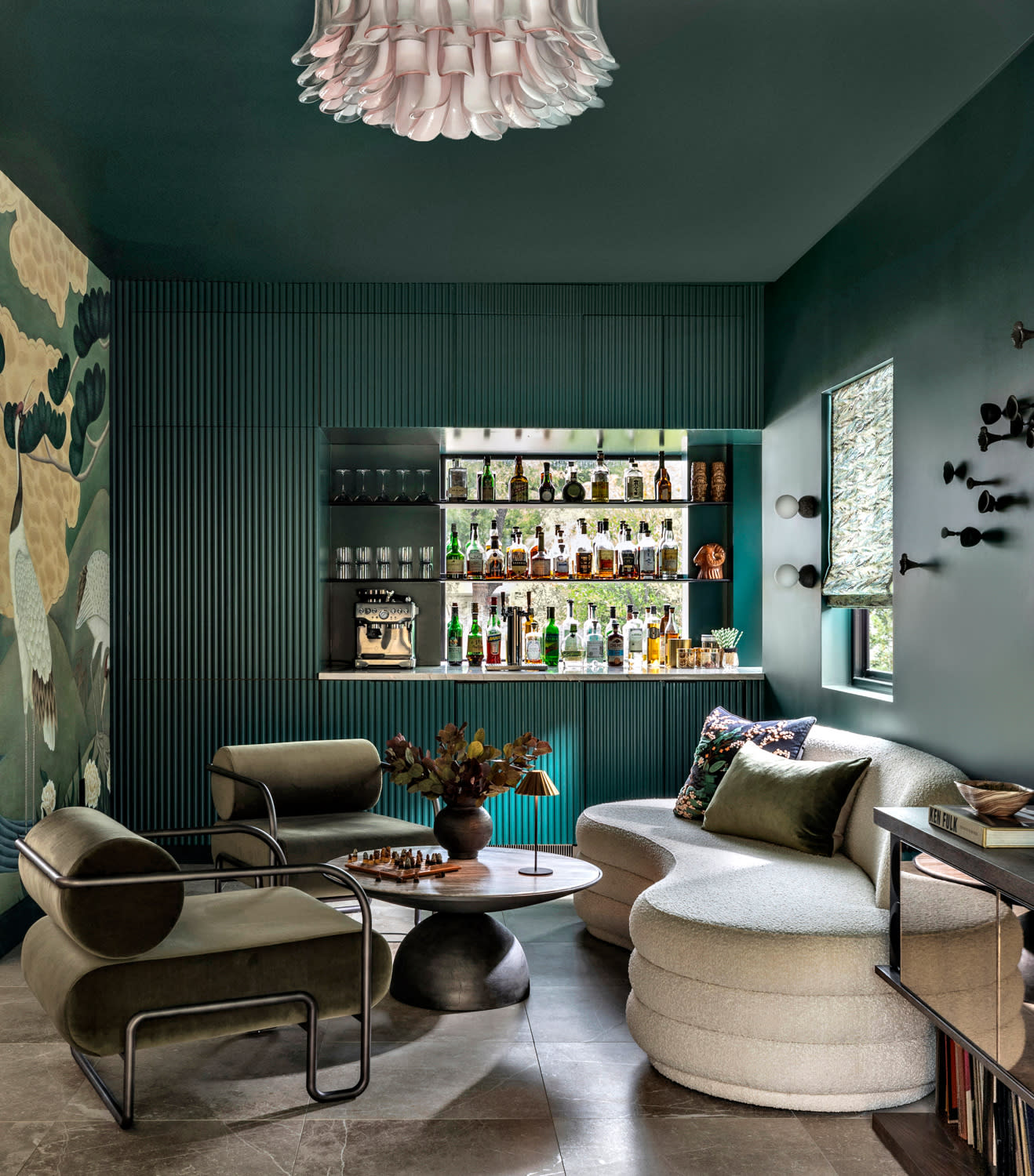 moody green lounge area inside an Austin home